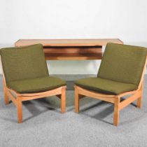 A pair of 1970's lounge chairs, together with an oak side table (3) 150w x 38d x 70h cm