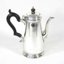 An early 20th century silver coffee pot, of tapered shape, with an ebonised handle and finial, by
