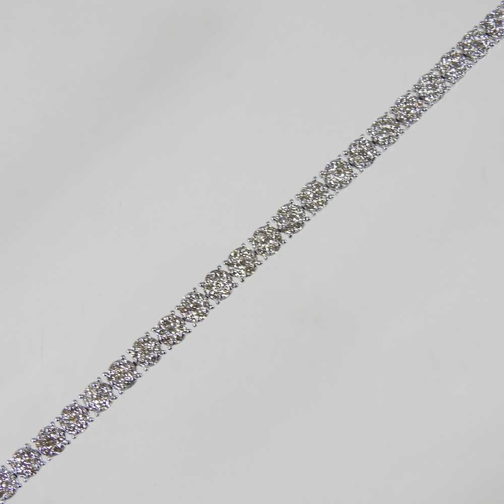 A 9 carat white gold diamond set line bracelet, set with approximately 3.0 carats of diamonds, - Image 2 of 6