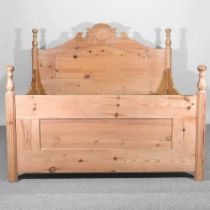 An antique pine bedstead, with a slatted wooden base 213w  x 164d x 125 h cm