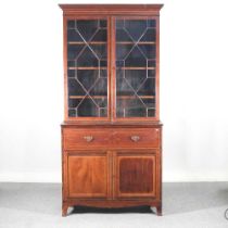 A George III mahogany, crossbanded and boxwood strung secretaire bookcase, of large proportions,