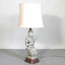 An Eastern pottery figural table lamp and shade, 80cm high overall
