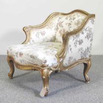 An early 20th century French upholstered gilt bergere chair 49cm wide