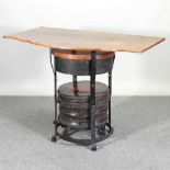 An oak side table, the base adapted from a pair of 19th century blacksmith's bellows 128w x 75d x