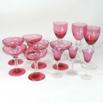 A set of six cranberry overlaid stem glasses, 12cm high, together with three others and three