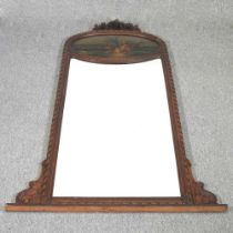 A large continental gilt framed trumeau mirror, with an inset panel depicting a courting couple, 180