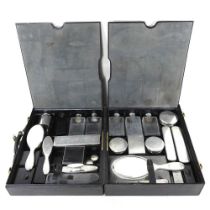 An early 20th century French silver travelling vanity set, in a fitted black leather case, 40cm
