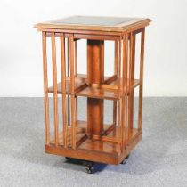 A yew wood reproduction revolving bookcase 47w x 47d x 87h cm