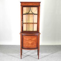 An Edwardian mahogany and inlaid bow front display cabinet 66w x 41d x 184h cm