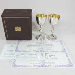 A pair of Garrard silver wine goblets, to commemorate the silver wedding of Her Majesty Queen