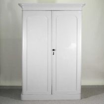 A Victorian and later grey painted pine double wardrobe, with a fitted interior, on a plinth base