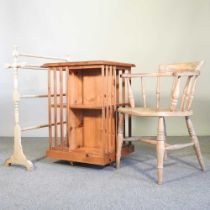 A pine revolving bookcase, 55cm wide, together with a 19th century towel airer and a smoker's bow (