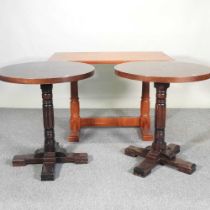 A pair of circular oak pub tables, together with another (3) 106w x 60d x 73h cm