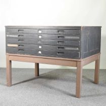 A mid 20th century painted plan chest, containing five long drawers, on square legs 122w x 89d x 93h