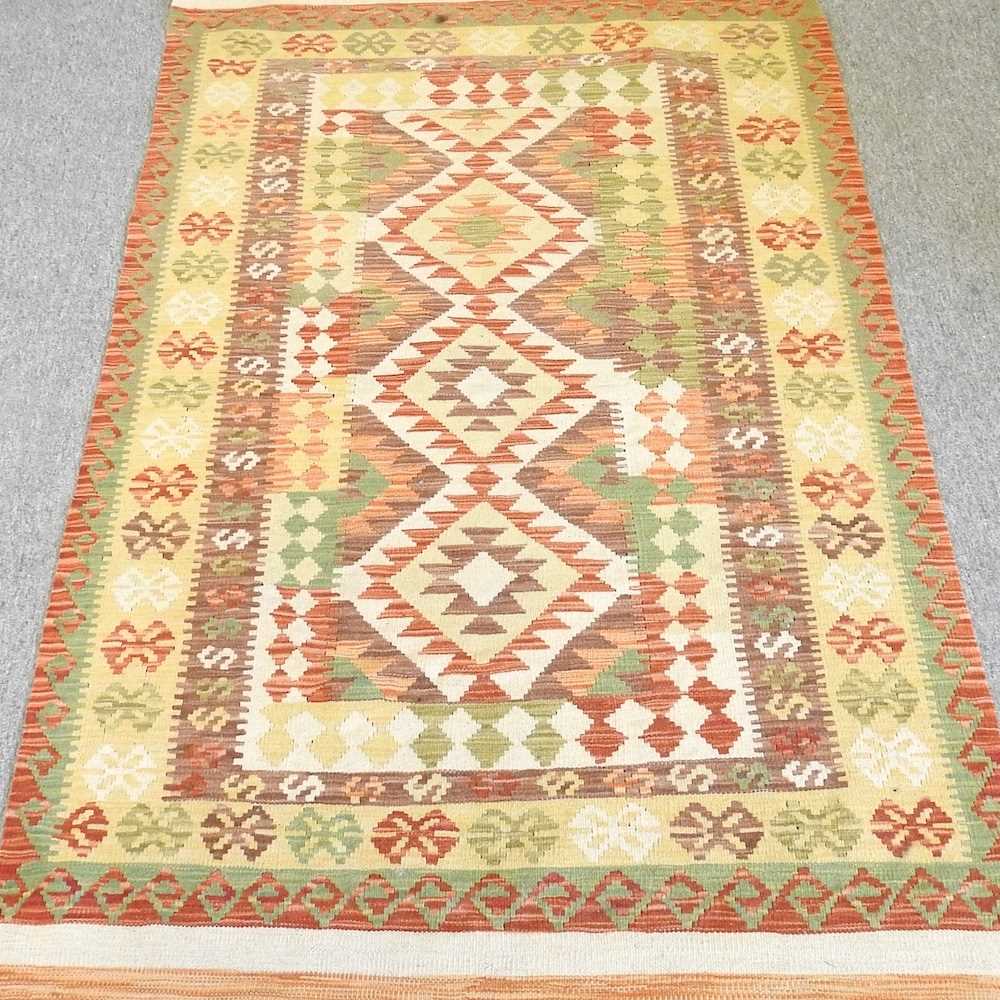 A kelim rug, 194 x 122cm, with all over geometric designs