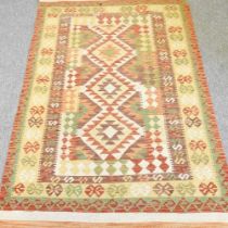 A kelim rug, 194 x 122cm, with all over geometric designs