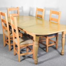 A modern beech dining table, together with a set of five ladderback dining chairs (6) 210w x 100d