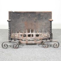 A cast iron fire back, initialled FKS, dated 1738, 74 x 49cm, together with a fire grate and a