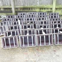 A collection of galvanised stable feeding troughs, 44cm wide (32)