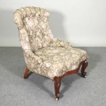 A Victorian upholstered chair, on cabriole legs