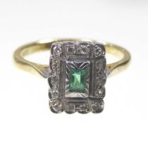 An Art Deco style 18 carat emerald and diamond cluster ring, the central emerald within a diamond