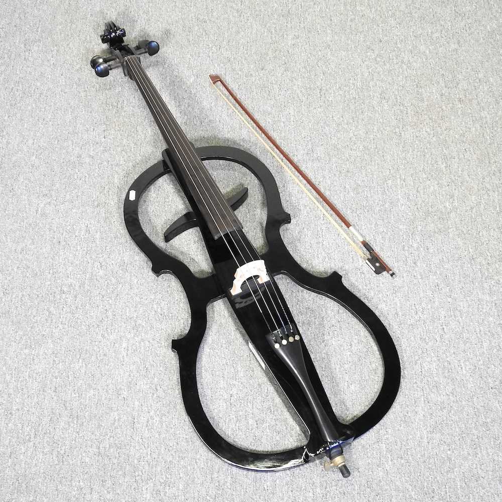 An Antoine Sonnet black electric cello, 125cm long, in a soft case Overall condition looks to be