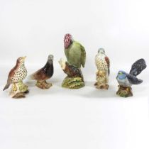 A Beswick pottery model of a woodpecker, 22cm high, together with a collection of four various