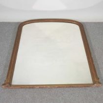 A Victorian gilt framed over mantel mirror, of arched shape, with a basketweave moulded surround,