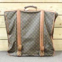 A Louis Vuitton vintage leather garment carrier, with LV monogram 60w x 55h cm