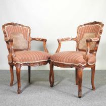 A pair of French style carved walnut show frame open armchairs (2)