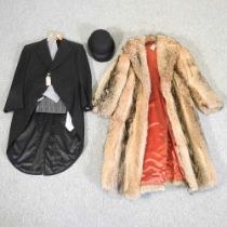 A fur coat, together with a morning suit and bowler hat