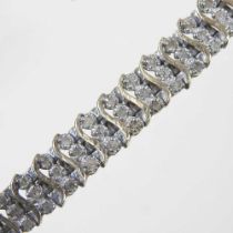 A 9 carat gold and diamond flexible link bracelet, set with approximately 2.0 carats of diamonds,