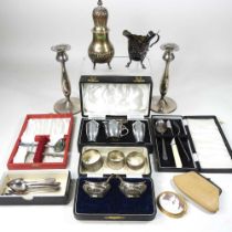 An early 20th century silver three piece condiment set, in a fitted case, together with a large gilt