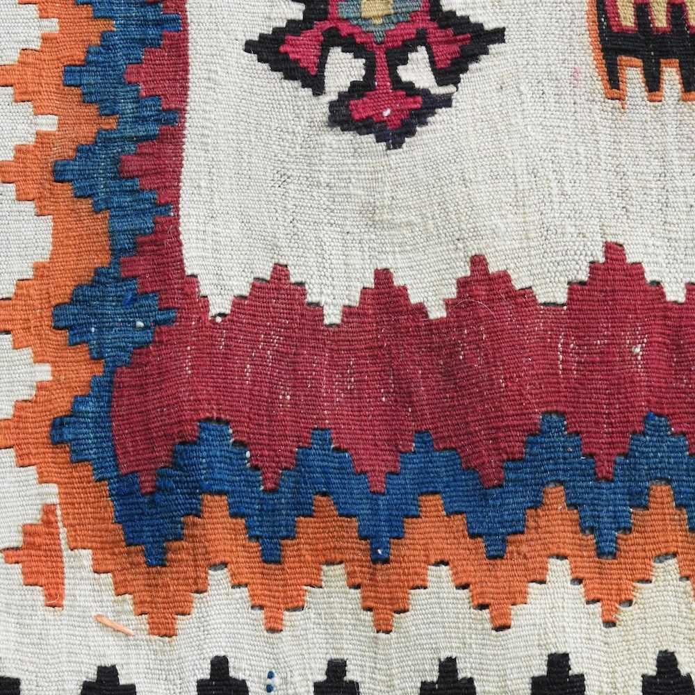 A Persian qashqai kilim, with coloured squares, within a zig zag border, 220 x 125cm - Image 3 of 5