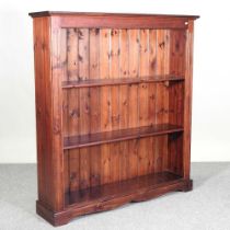A modern stained pine standing open bookcase 127w x 31d x 139h cm