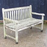 A teak slatted wooden garden bench 130w x 61d x 91h cm
