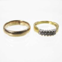 A 9 carat gold wedding band, 4.6g, size Q/R, together with a five stone diamond ring, marked