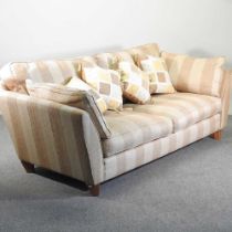 A modern gold striped upholstered sofa, with loose cushions 225w x 100d x 88h cm