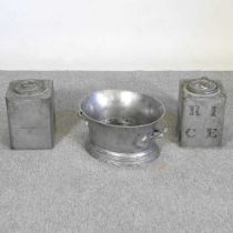 A metal wine bath, 45cm wide, together with a pair of metal tea canisters (3)