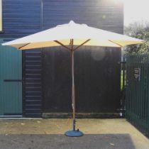 A garden parasol, on a metal base
