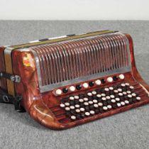 A Hohner Norm VII S accordion, in a hard case