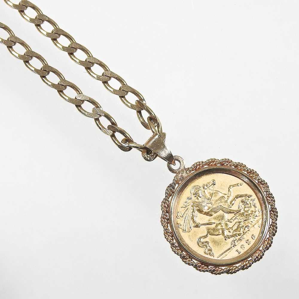 A 9 carat gold pendant, with a George V half sovereign dated 1926, suspended on a 9 carat gold