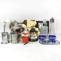 A glass claret jug, with silver plated mounts, together with decanters, mugs and other items
