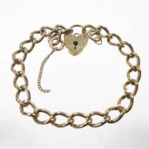 A 9 carat gold curb link bracelet, the padlock shaped clasp with safety chain, 15g, 17cm long