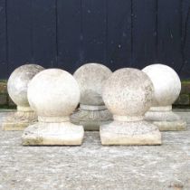 A collection of five cast stone ball markers, 31cm high (5)