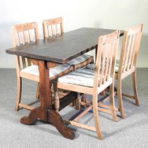 An oak dining table, together with a set of four oak dining chairs (5) 137w x 59d x 76h cm
