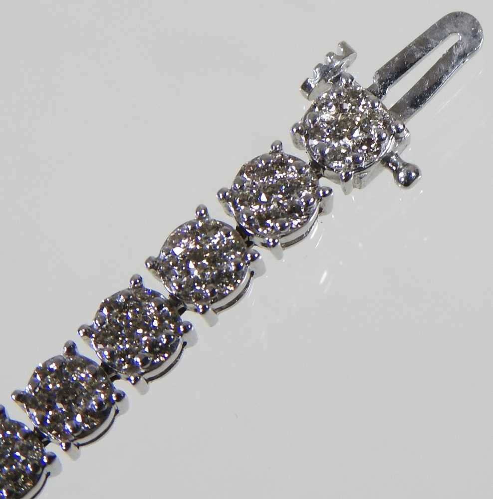 A 9 carat white gold diamond set line bracelet, set with approximately 3.0 carats of diamonds, - Image 4 of 6