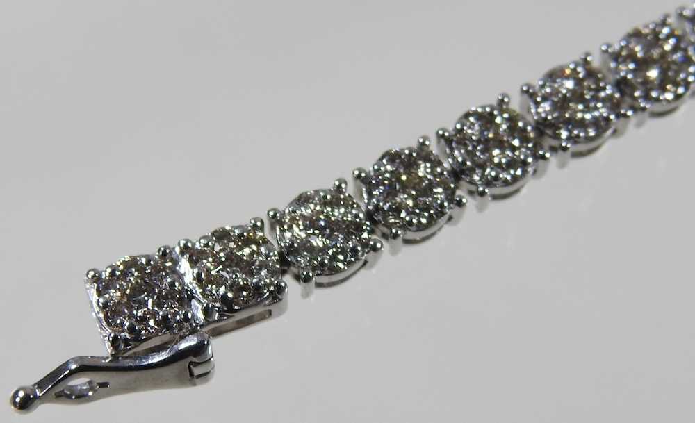 A 9 carat white gold diamond set line bracelet, set with approximately 3.0 carats of diamonds, - Image 3 of 6