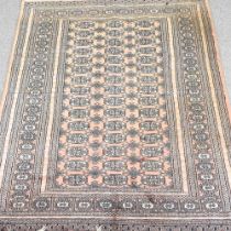 A modern Bokhara rug, with three rows of medallions, 185 x 216cm