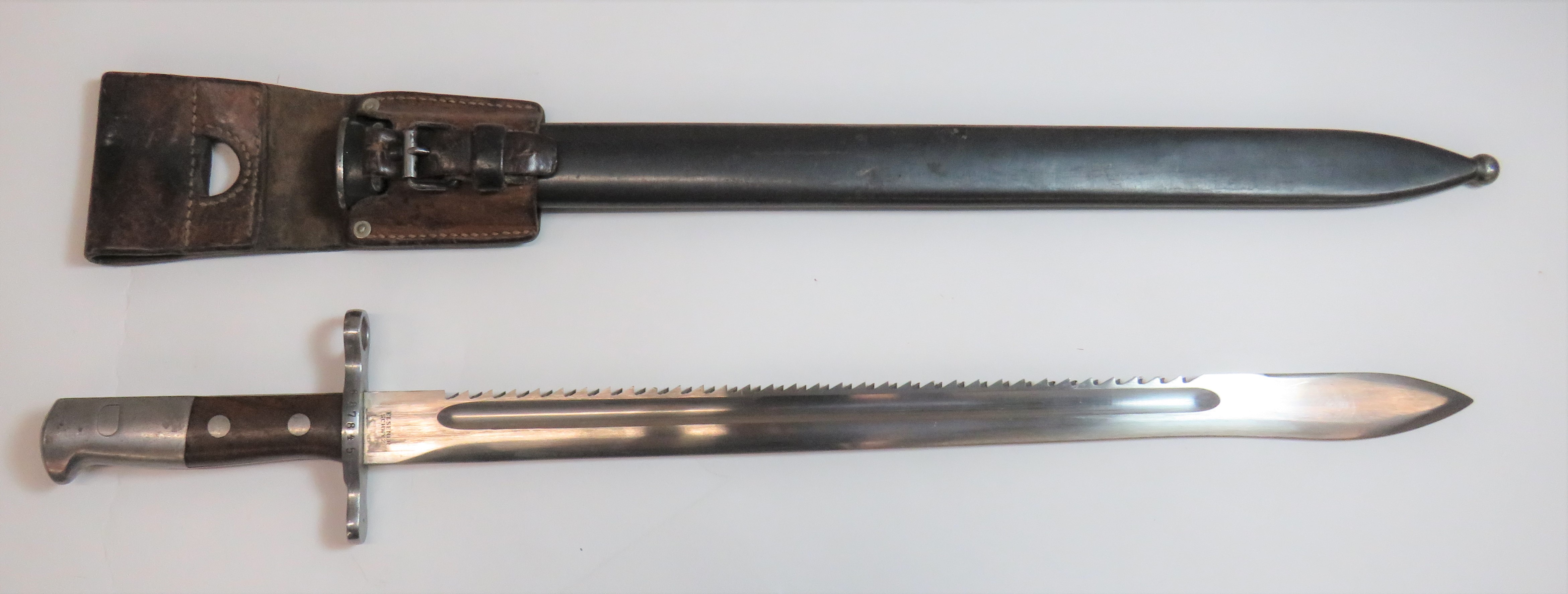 Swiss Model 1914 Schmidt Rubin Sawback Bayonet 18 .75 inch single edged blade with rear sawback .